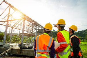 Engineer technician watching team of workers