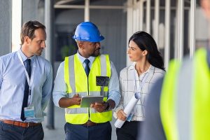 A group of people talking at a construction site