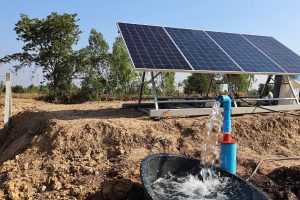solar panels and water running from a pipe