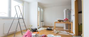 A room in the middle of renovation with paint and other chemicals exposed.