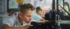 boy using school 3D printer