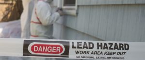 A work area enclosure with the label "Danger, Lead Hazard, Work Area Keep Out"