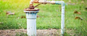Well pump coming out of the ground.