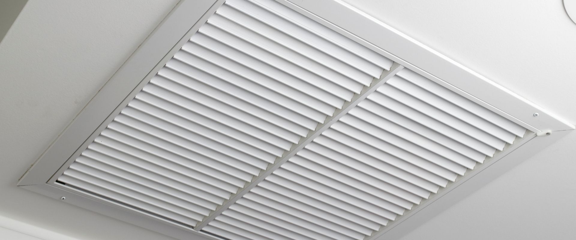 A white ceiling vent